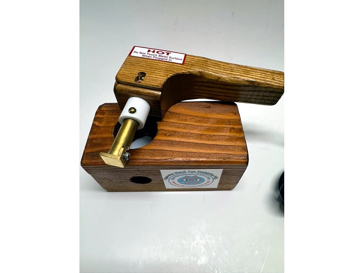 MM 4 single stamp iron with wood handle resting in its wooden stand
