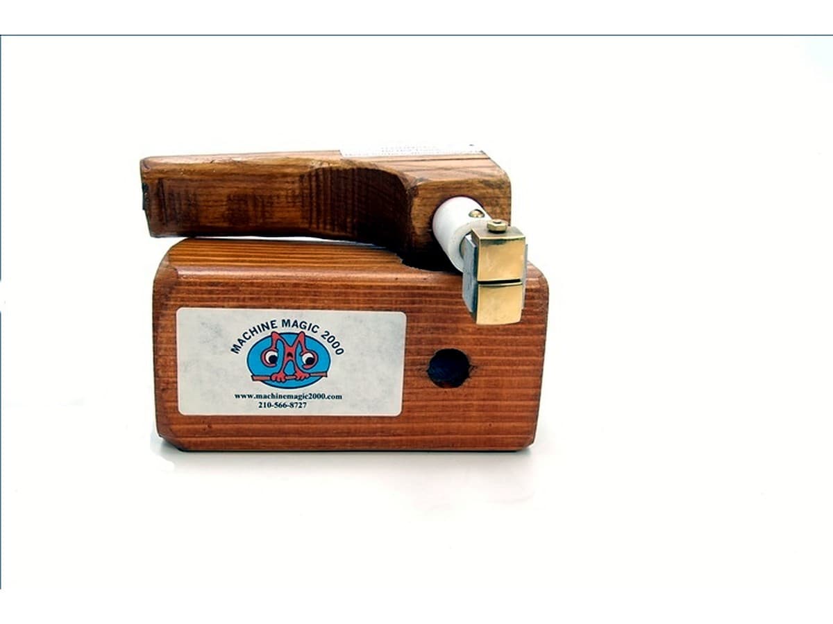 MM 4TS two stamp iron with wood handle beside its wooden stand
